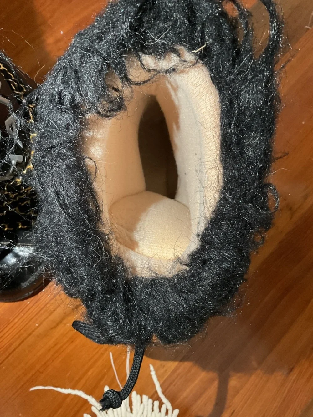 CHANEL Black and Gold Quilted Winter Lace-Up Boots